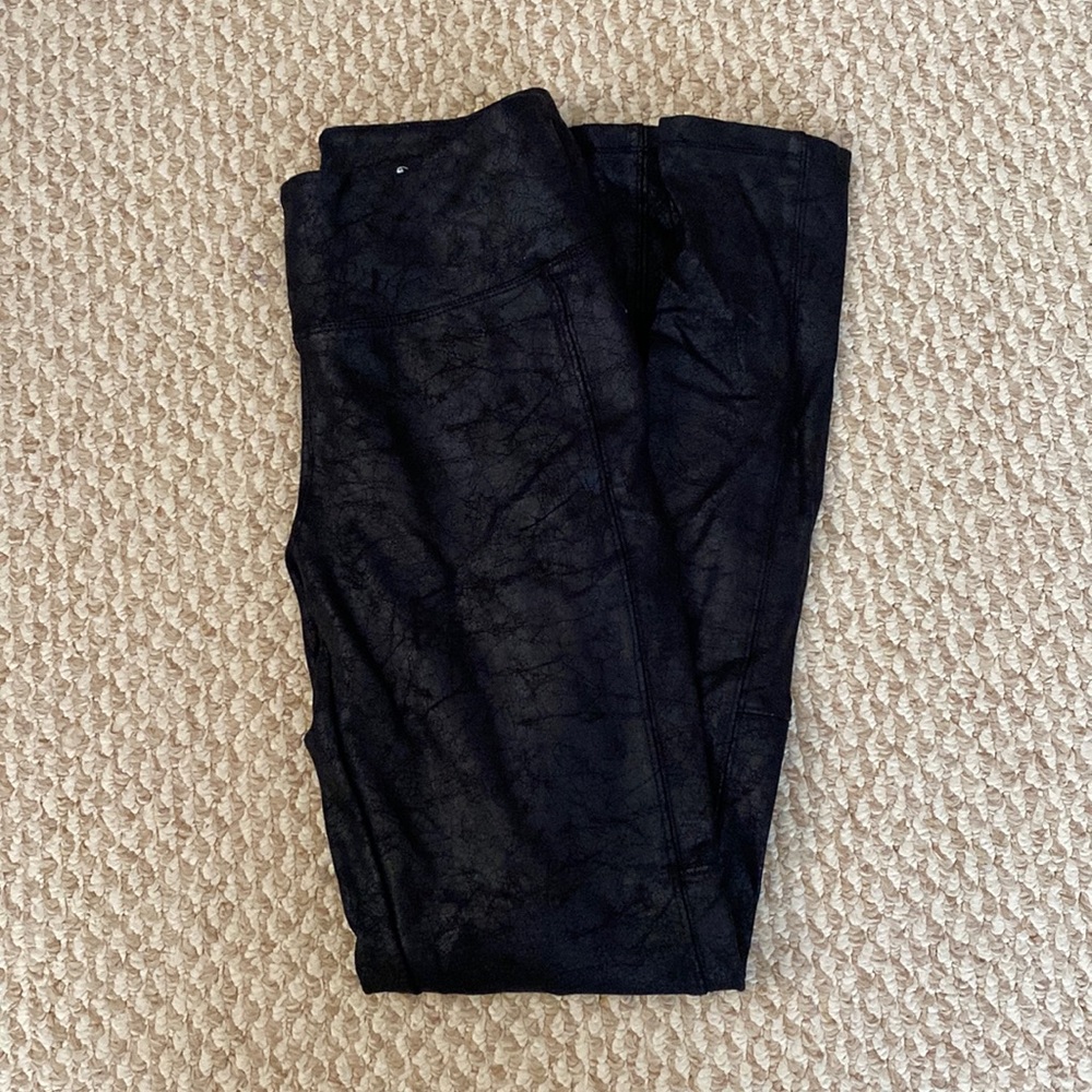 Pleather black leggings in size S.